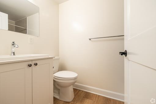 an empty bathroom with a toilet and a sink