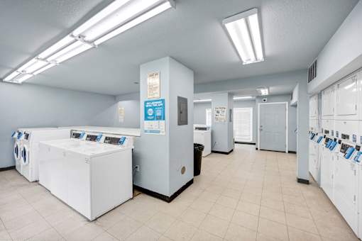 A laundromat with washers and dryers.