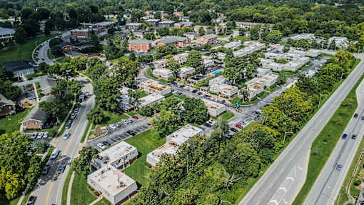 A bird's eye view of a small town with a mix of residential and commercial buildings.