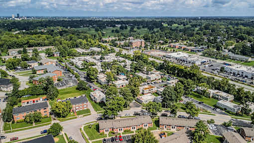 A bird's eye view of a residential area with houses and trees.