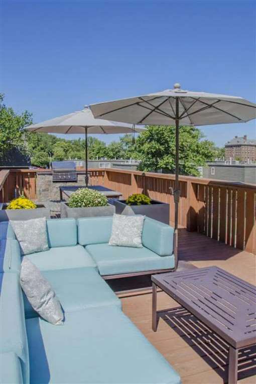 Patio with large comfortable couch at Lexington Square, Lexington, KY