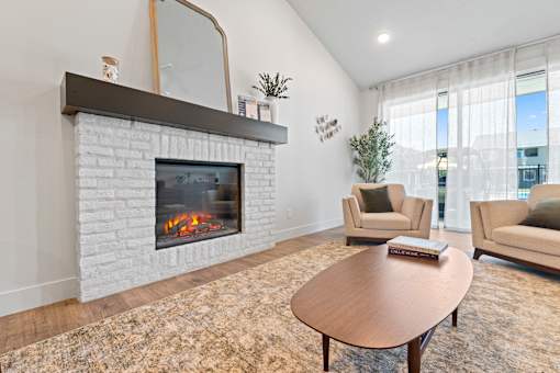 A living room with a fireplace and a couch.