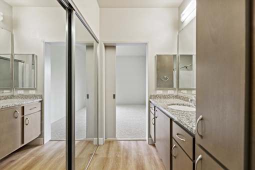 A bathroom with a walk-in shower and a sink.