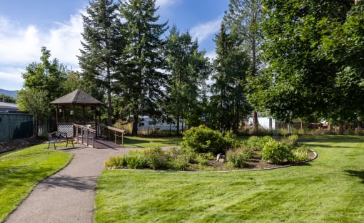 a park with a picnic area and a gazebo