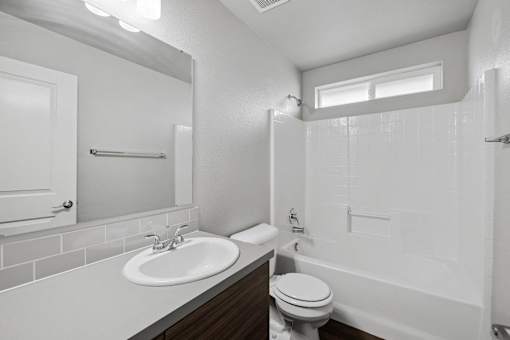 the preserve at ballantyne commons apartment bathroom with sink toilet and shower
