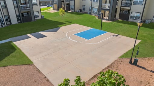 a basketball court in the backyard of an apartment complex at The Vineyards of Colorado Springs, Colorado