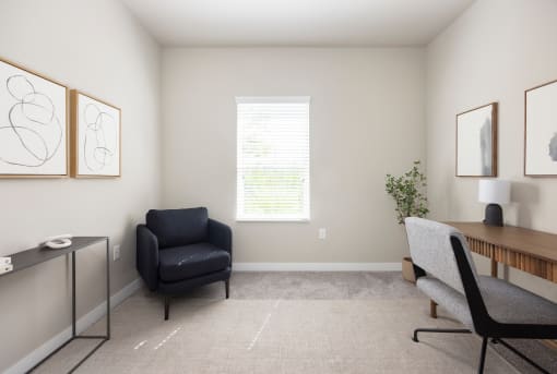 an office with a black chair and a wooden desk at The Alloy at Geneva, Vineyard, UT
