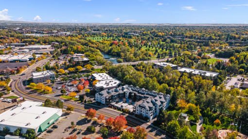 an aerial view of a city with trees and buildings at River Walk Apartments, Boise, ID, 83702