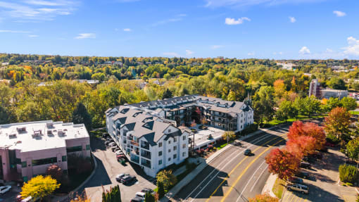 an aerial view of an apartment building in the city at River Walk Apartments, Boise, ID
