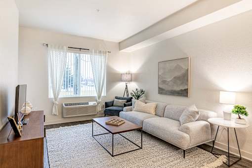 a living room with a couch and a coffee table at Corso Apartments, Missoula, MT