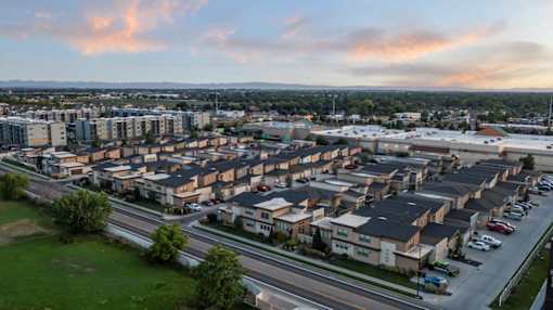 A view of a residential area with houses and apartment buildings. at Verraso Village Apartments, Meridian 83646