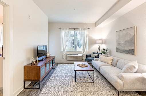a living room with a couch and a coffee table at Corso Apartments, Missoula, MT