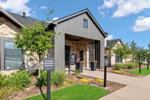 the front of a building with a sign in front of it at The Vineyards of Colorado Springs, Colorado Springs, CO