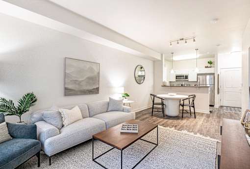 a living room with a couch and a coffee table at Corso Apartments, Missoula, MT