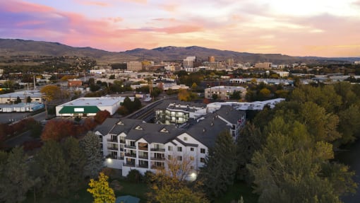 an aerial view of a building with a city in the background at River Walk Apartments, Boise, ID, 83702