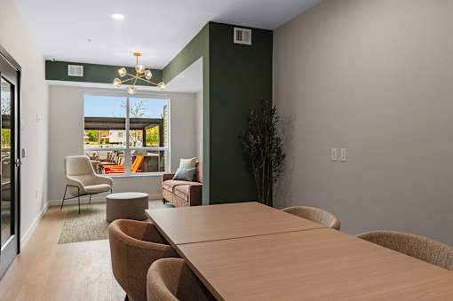 A conference room with a long table at The Beaumont Apartments, Bozeman, Montana 59715