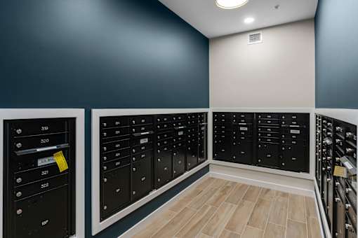 A row of black lockers with numbers on them at The Beaumont Apartments, Montana