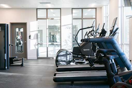 A gym with treadmills and exercise equipment.at Copestone Apartments, Garden City, ID 59808
