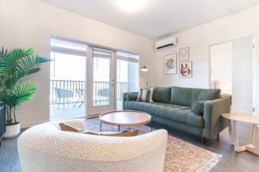 Living Room With Balcony at Copestone Apartments, Garden City, ID