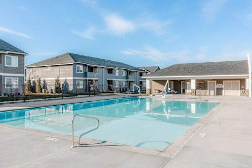 the preserve at ballantyne commons swimming pool with apartment buildings