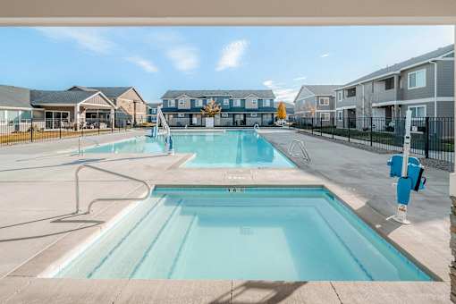 the preserve at ballantyne commons pool with apartment buildings
