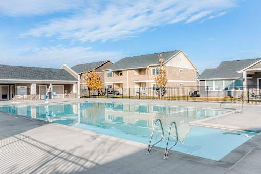 the preserve at ballantyne commons pool with apartment buildings in the background