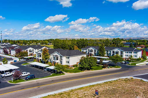 an aerial view of a neighborhood of houses on a city street at Eagles Landing Apartments, Ammon, ID