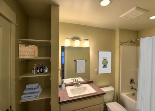 A bathroom with a sink, toilet, and shower.