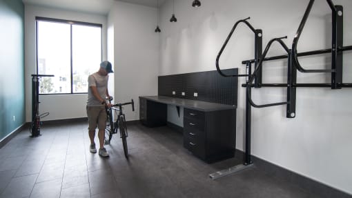 Bike storage and gear shop area at Cycle Apartments, Colorado