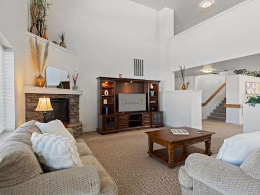 A living room with a fireplace and a couch.
