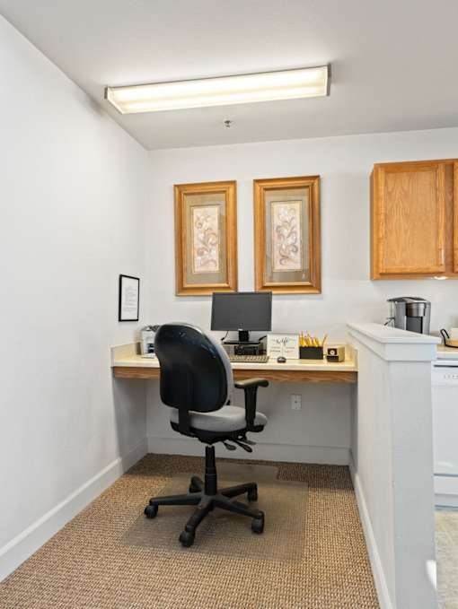 A small office with a desk and a computer.