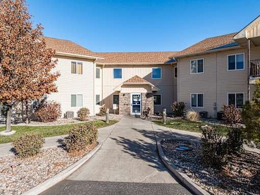 A sunny day at a residential complex with a clear blue sky.
