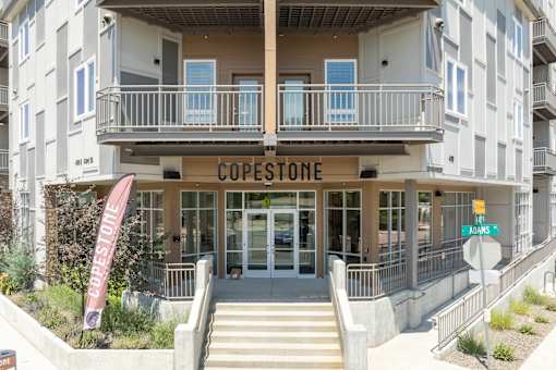 The Copestone building has a red banner on the front.