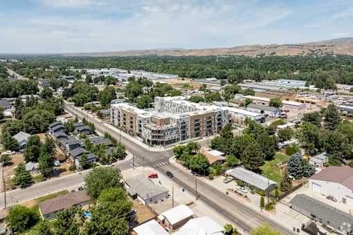 A small town with a large building in the middle of the street.