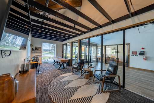 A room with a black and white rug and wooden floors. at Silverbrook Apartments, Montana