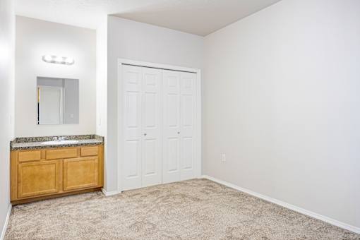 A white door is in a white wall.