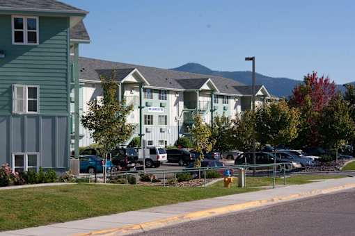 A row of houses with cars parked in front at Great Northern, Missoula, MT
