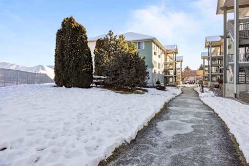 snow-covered pathway leads to residential area at Great Northern, Missoula Montana