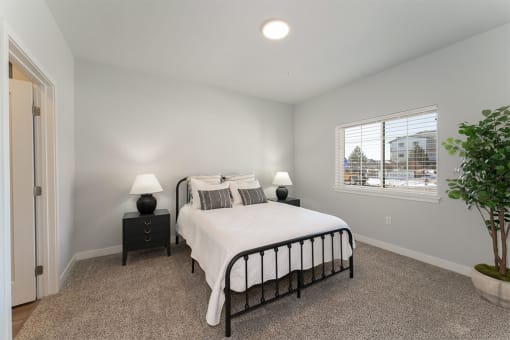 Bedroom with cozy bed at The Expo Apartments, Montana