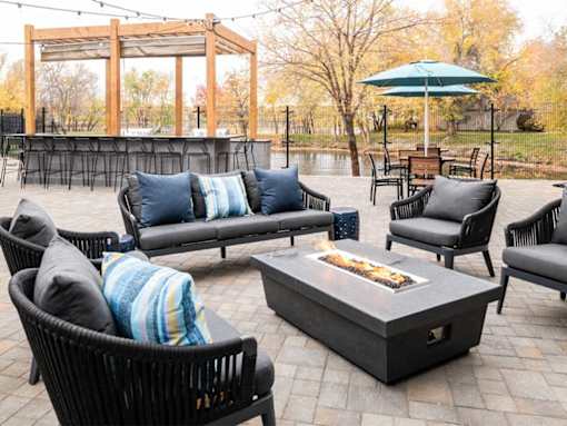 Outdoor fire pit lounge area with modern seating at Edgewater Apartments, Boise, ID