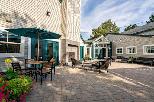 Brick patio courtyard with outdoor furniture at Edgewater Apartments, Idaho