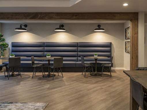 Modern dining area with upholstered banquette seating at Edgewater Apartments, Boise, ID