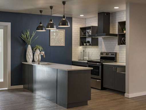 Modern kitchen island with pendant lighting at Edgewater Apartments, Idaho