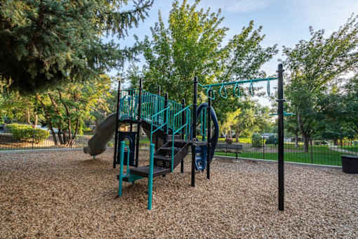 Playground with slides and climbing equipment at Edgewater Apartments, Boise, 83703