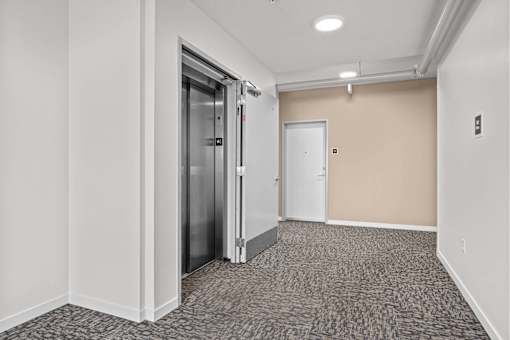 A hallway with a carpeted floor at Majestic Drive, Missoula, 59808