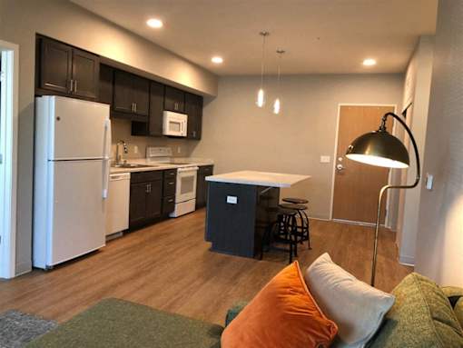 Affordable 1-3 bedroom apartment interior at Morrow Apartments in St. Paul, MN featuring a modern kitchen island