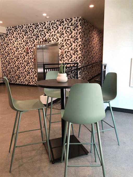 A green lamp is mounted on a metal frame.