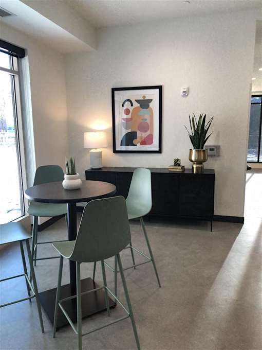 A picture of a chair is hanging on the wall.