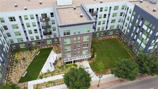 Community courtyard and green space at Morrow Apartments, offering affordable 1-3 bedroom rentals in St. Paul.