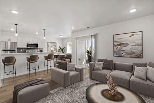 A modern living room with a grey sofa set and a coffee table.